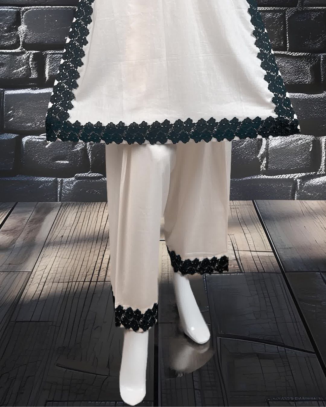 wearing a white dress with black lace work along with farshi shalwar.