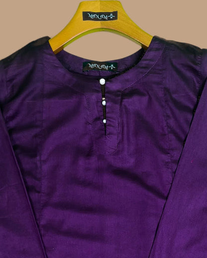  a casual women dress plum colour  shirt on a hanger with 'Manam' branding against a beige background