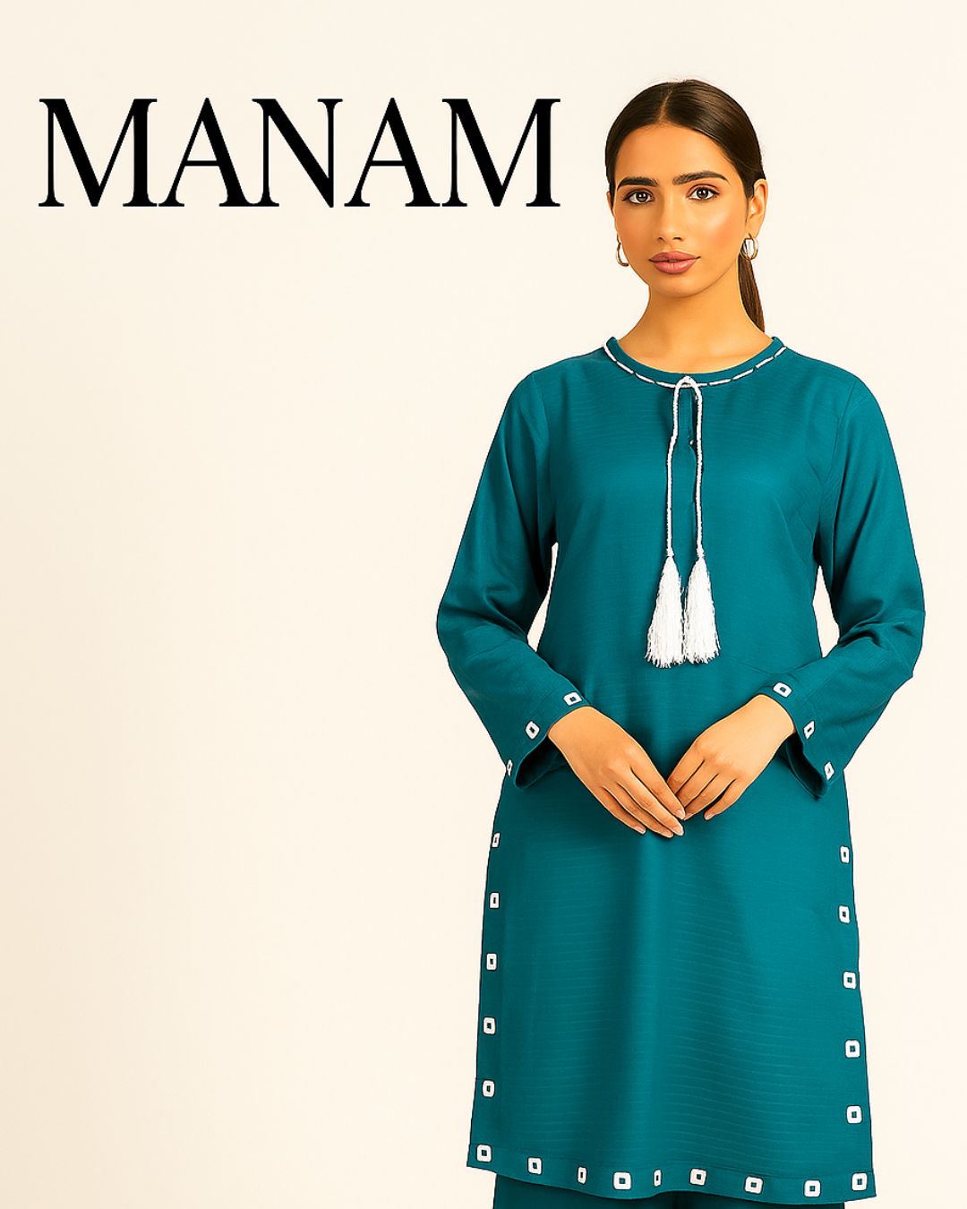 Woman wearing a teal summer clothes for women with silver tassels and sheesha works, standing against a beige background with MANAM brand 