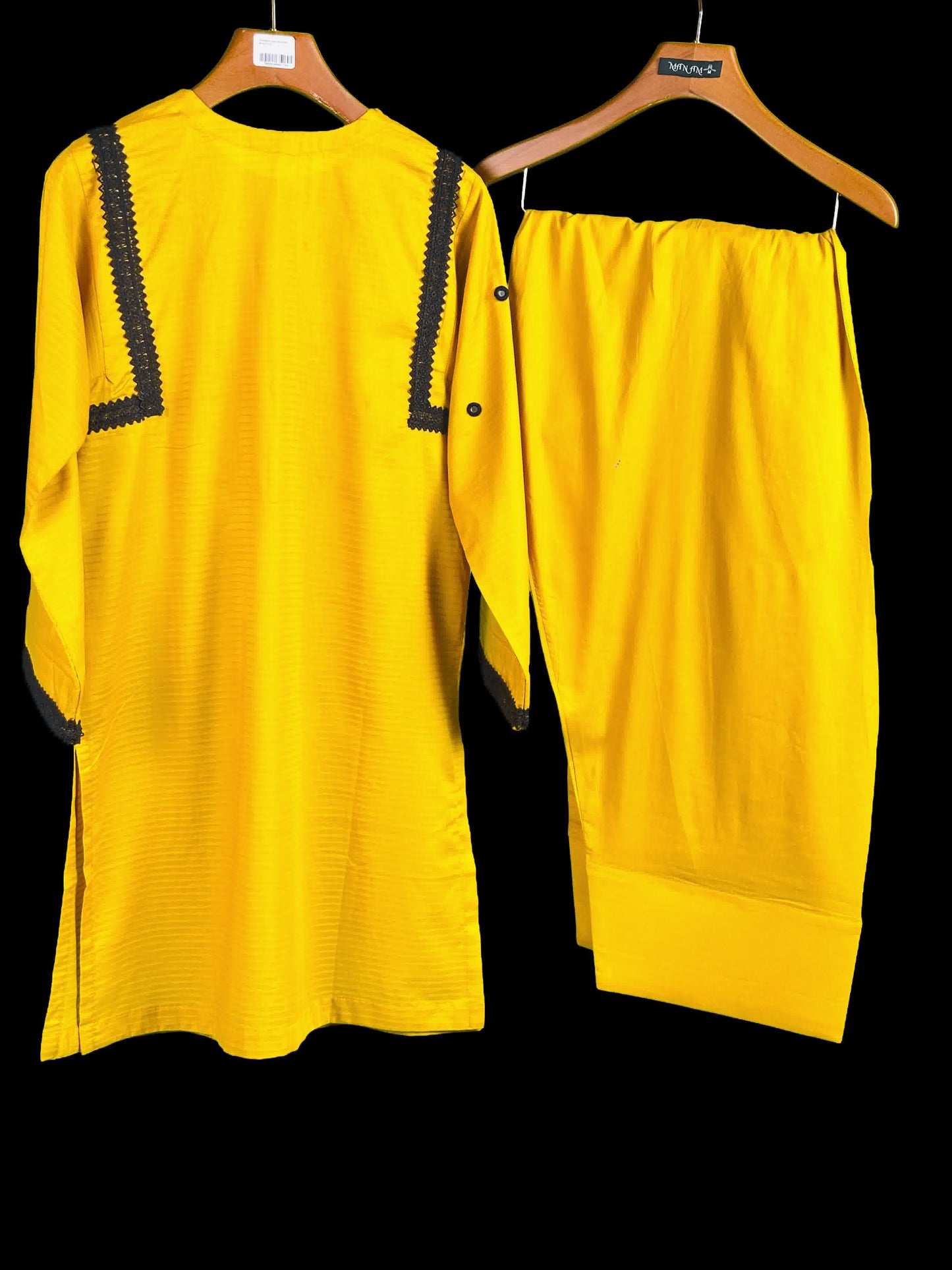 showing new summer collection dresses Yellow kurta with black lace work on kurta backside with farshi shalwar on a hanger