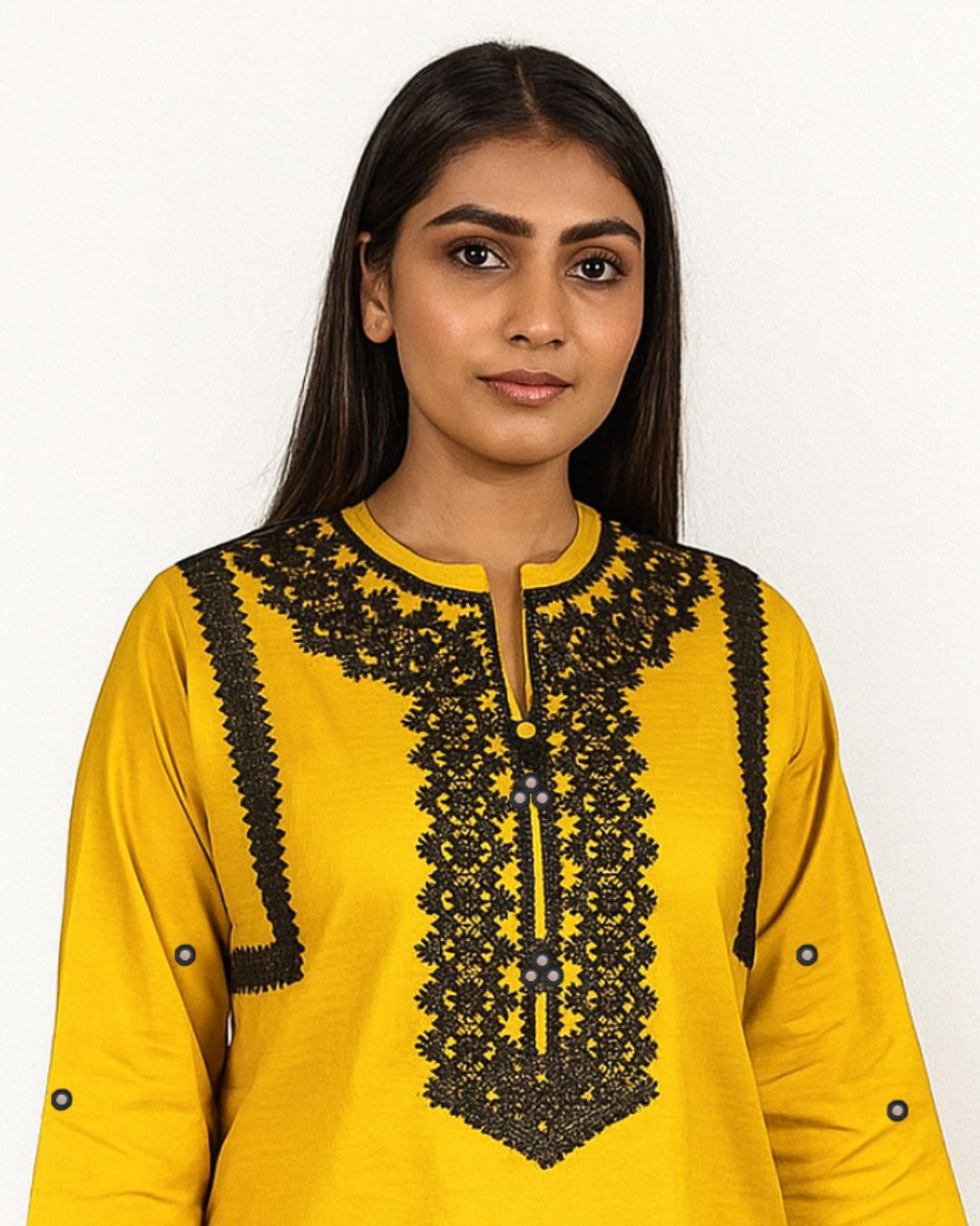 Woman wearing a summer collection yellow kurta with black lace embroidery, neck design 
