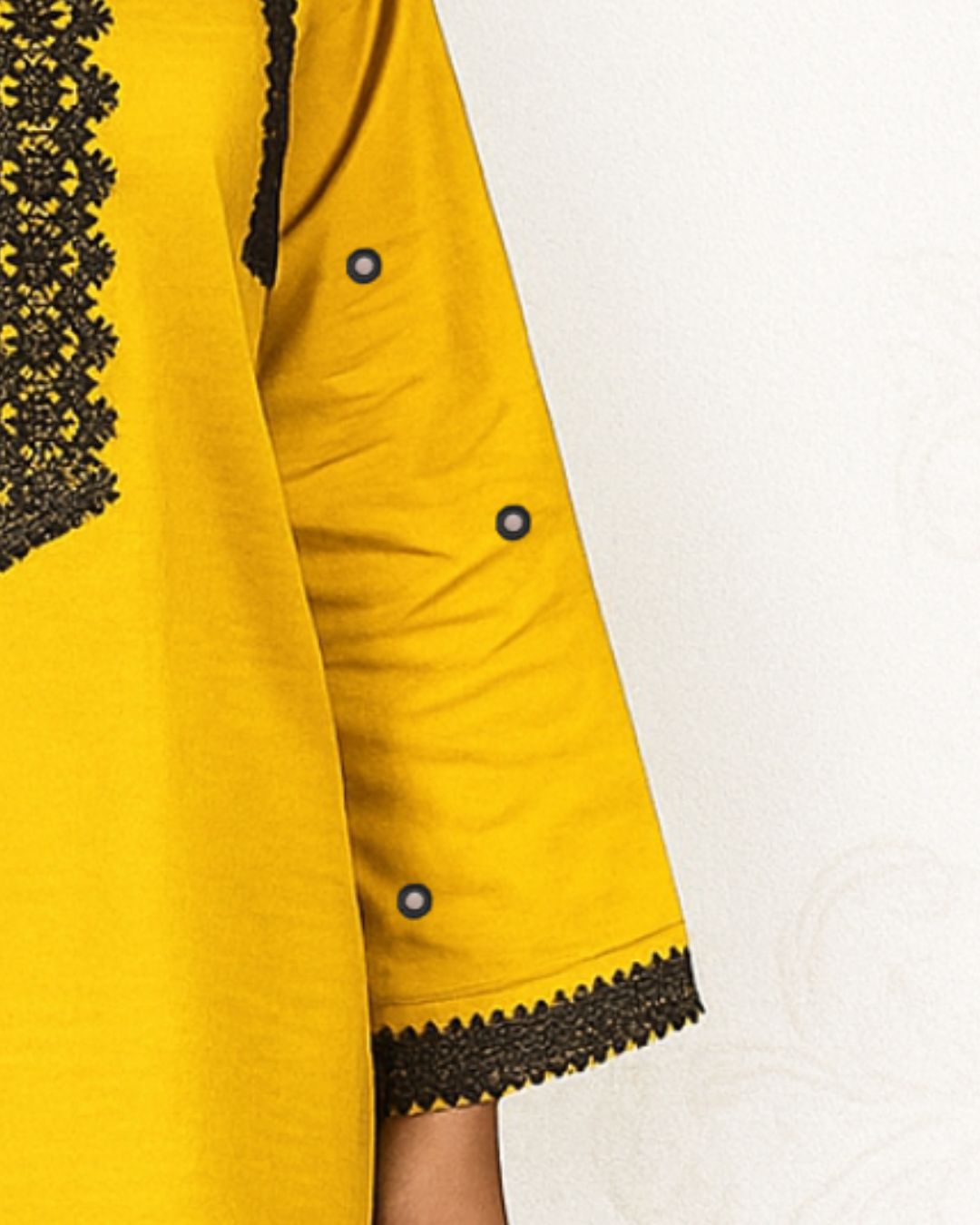 Yellow kurta with black lace and sheesha 
 work sleeves design detail on a white background
