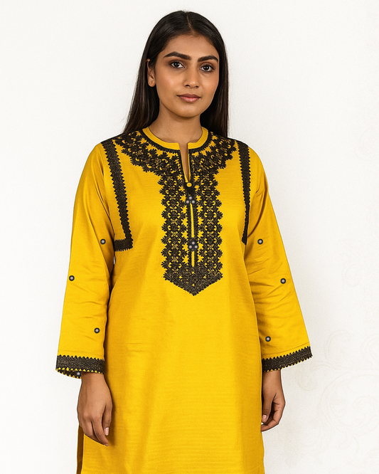 Woman wearing a yellow  new best summer collection kurta with black lace and sheesha work by Manam